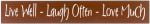 Chocolate wooden kitchen sign with the text "Live Well, Laugh Often, Love Much" in Off White text through the middle of the sign.