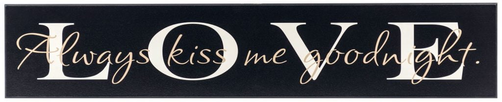 Black romantic wooden sign with the word "Love" in off white across the front of the sign and the saying, "Always kiss me goodnight" in tan through the middle of the sign.